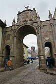 The Colonial archway of Santa Clara in Cusco looking towards the towers of San Pedro. 